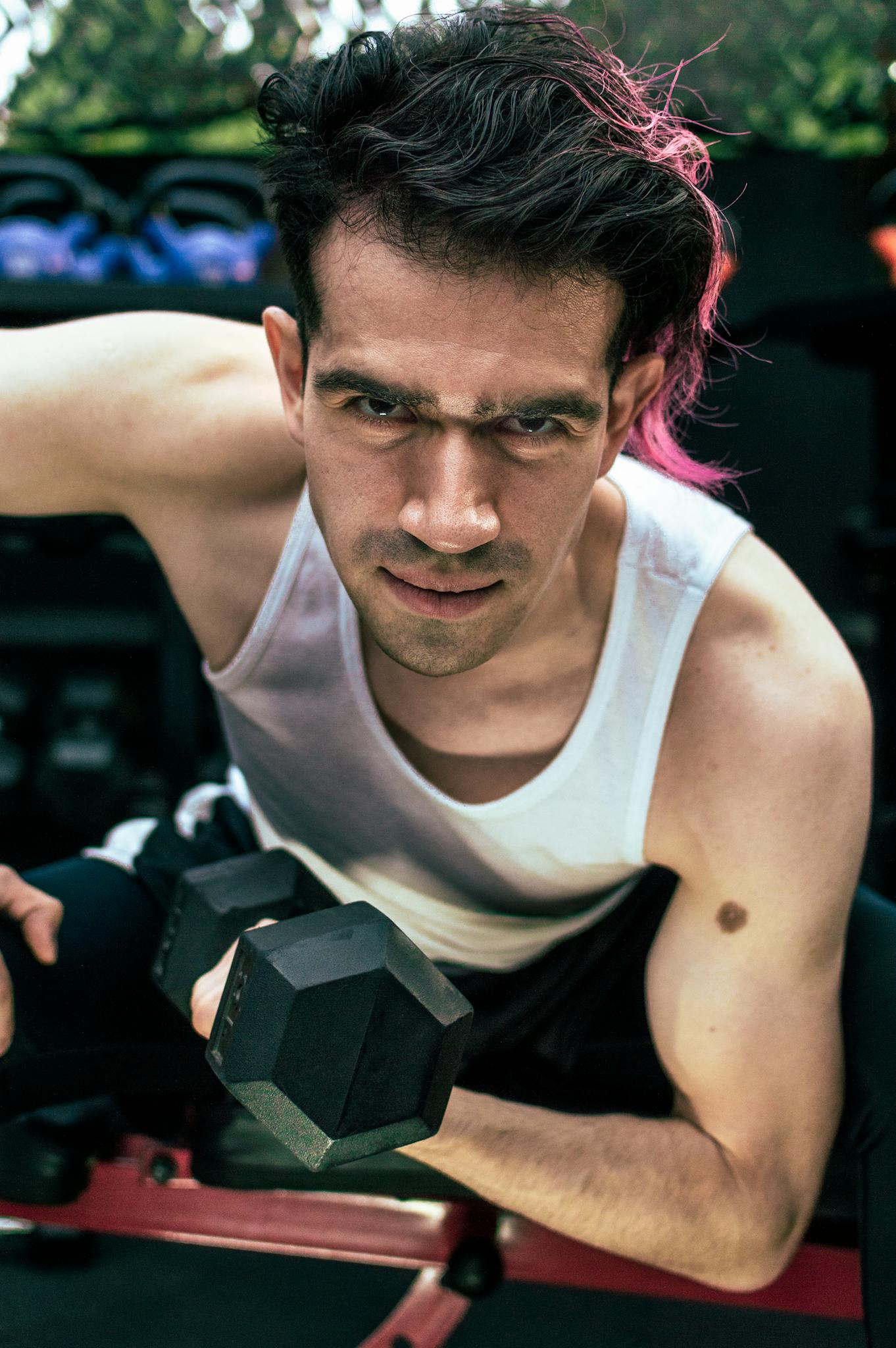 a man using dumbbell 1