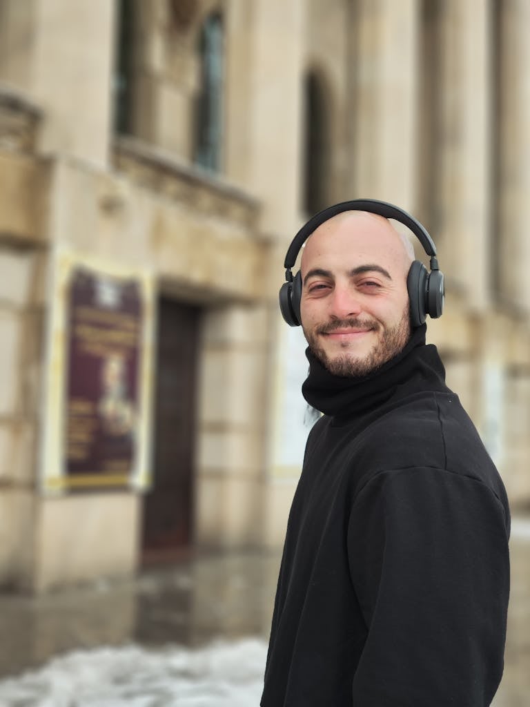 Bald Man in Black Jacket Smiling