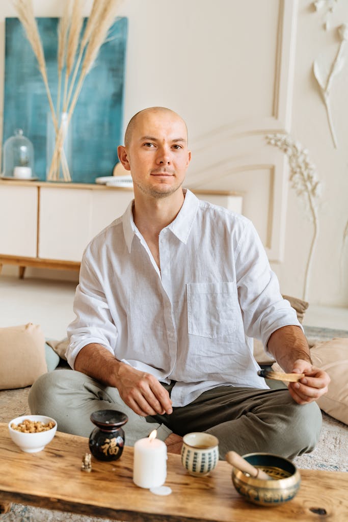 A Man Holding a Palo Santo